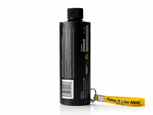 Black ink bottle with a yellow tag on a white background